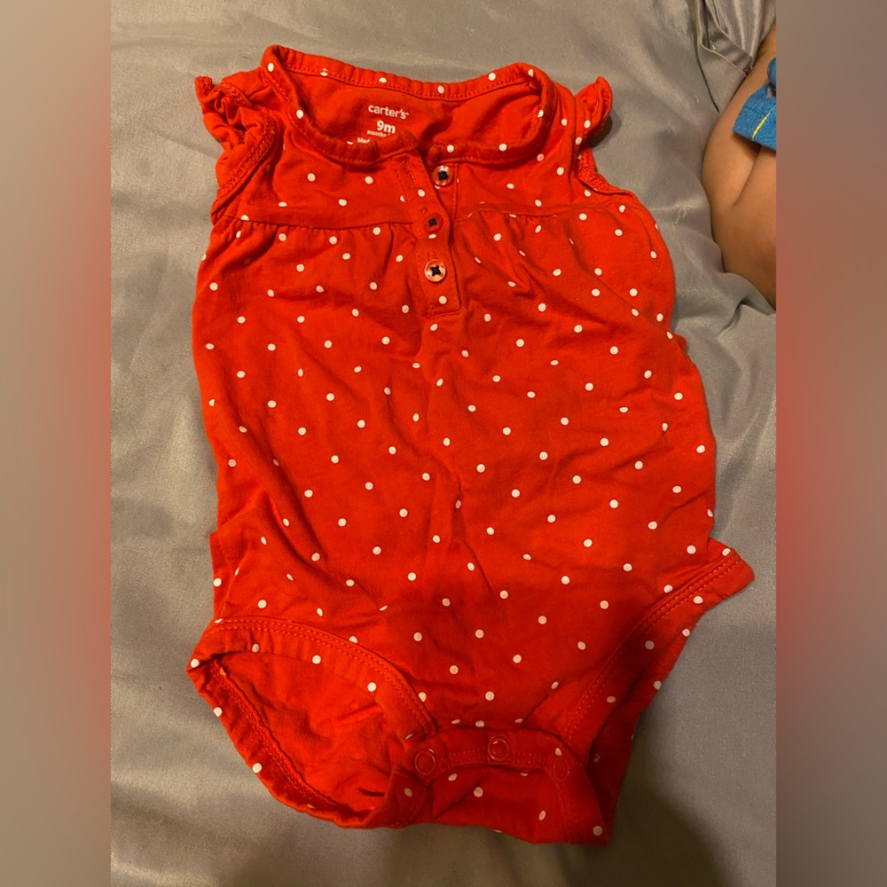 Red and white polka dot onesie